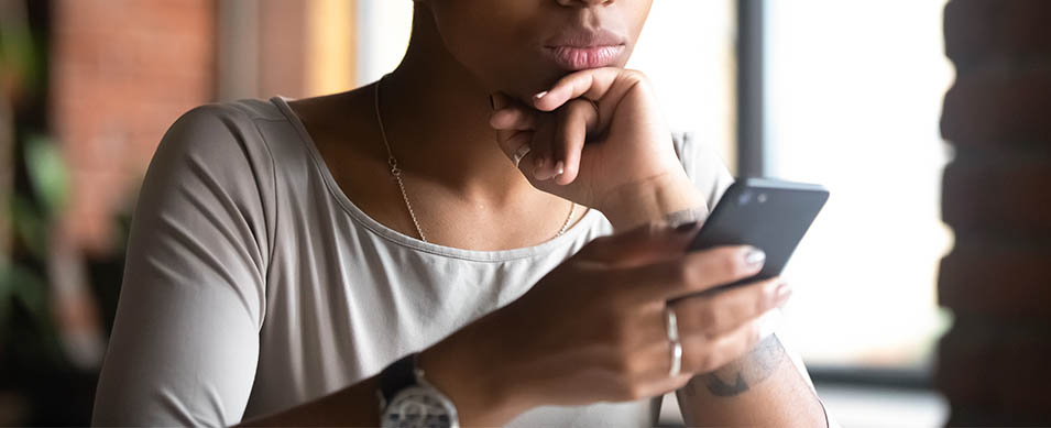 A millennial woman on her phone.